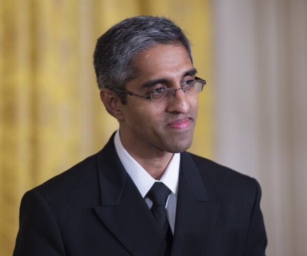 murthy in a black suit and tie