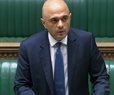 UK Minister Apologizes for Urging People Not to 'Cower From' COVID