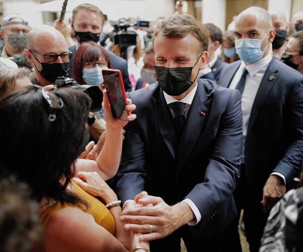 France's Macron Slapped in Face During Walkabout