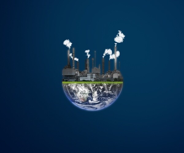 globe with smokestacks with smoke coming out illustrating global pollution