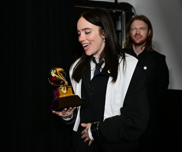 singer song writer receives award for song of the year in the city of angels of the golden state of the united states 