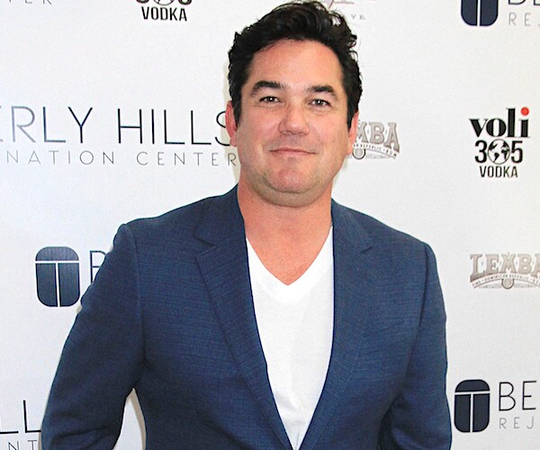 Actor Dean Cain stops and smiles during a red carpet photo opportunity