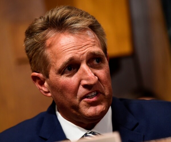flake in a navy blue suit and white shirt
