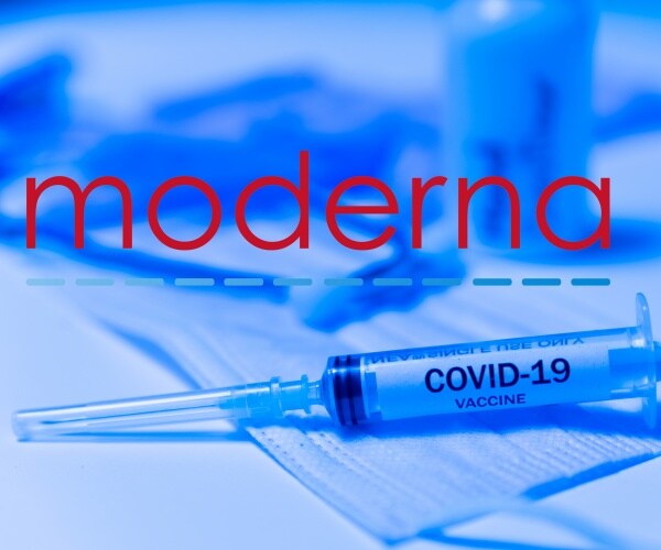 Moderna spelled out in red and syringe labeled 'COVID-19 vaccine'