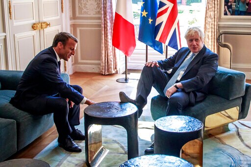 Foot on Table: British PM at Home in French President Palace