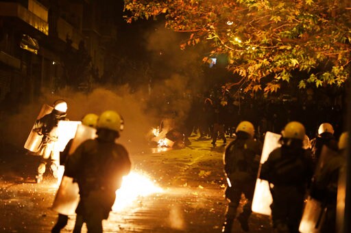 The Latest: Youths in Greece Attack Police with Gas Bombs