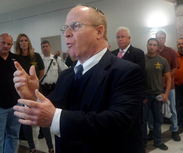 david schoen speaks to press