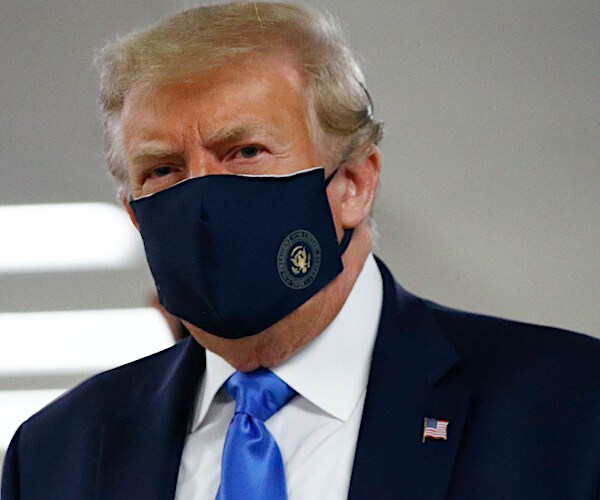 president donald trump dons a dark face mask at Walter Reed Medical Center