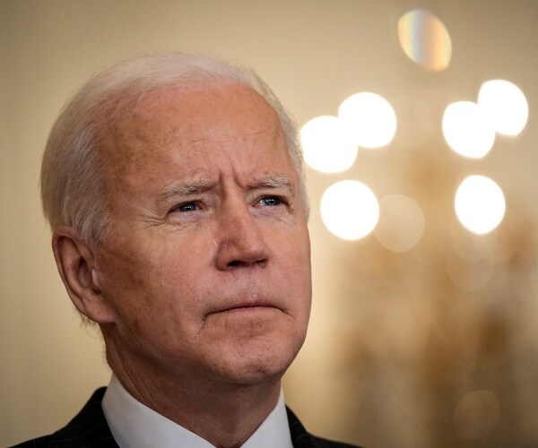 joe biden stands in east room