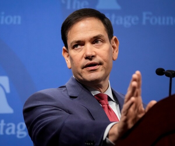 marco rubio speaks into a microphone