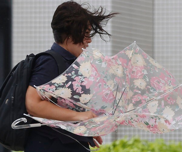China, Japan Ground Ferries, Flights as Typhoon Approaches