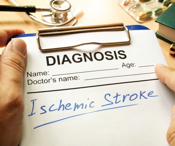 clipboard with diagnosis of ischemic stroke written on paper