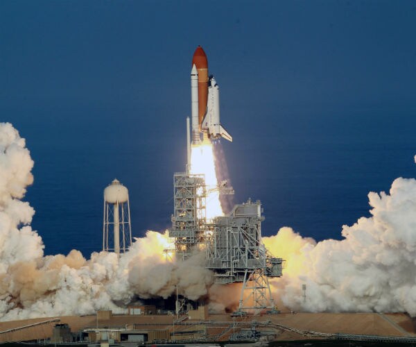 space shuttle discovery takes off