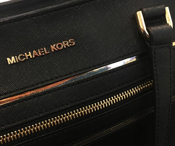Michael Kors Gives Weak Forecast, to Shut 100 Stores