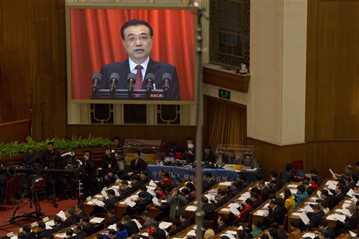 China Tries to Reassure on Economy, Cuts Growth Target
