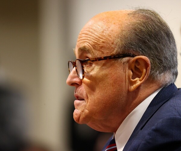 rudy giuliani sits in courtroom