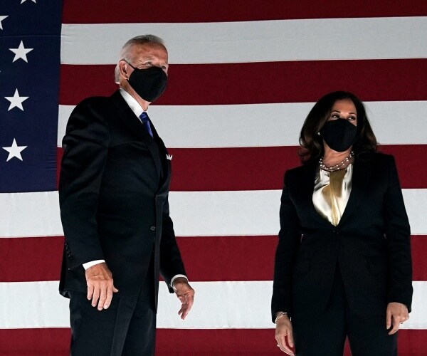 Joe Biden and Kamala Harris greet supporters at dnc