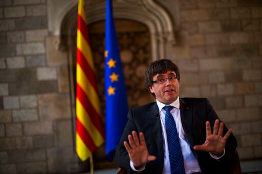 The Latest: Puigdemont Says Vote Crackdown Boosting Support