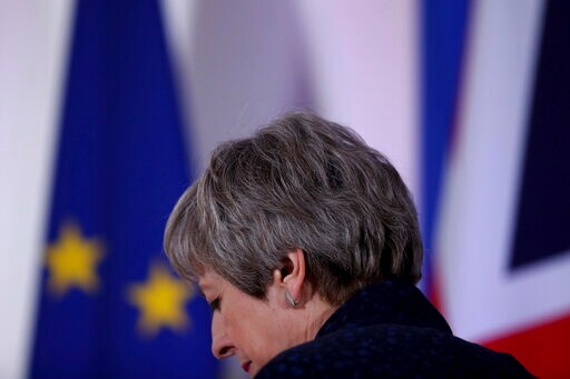 The Latest: May, Brexit Critics Face off in Crisis Meeting
