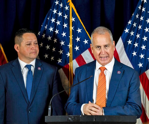 rep tony gonzales, left, and rep mario díaz-balart attend a news conference