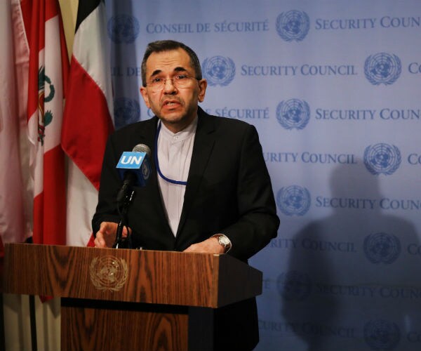 Iran's Ambassador to the United Nations Majid Takht Ravanchi speaks to the media before a meeting.