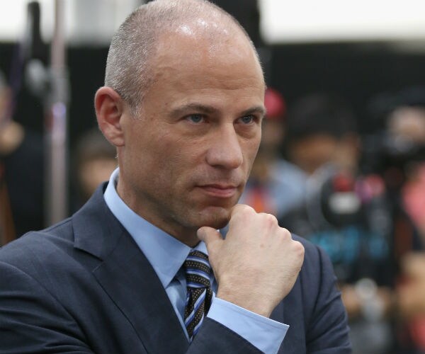 Michael Avenatti holds his hand to his chin