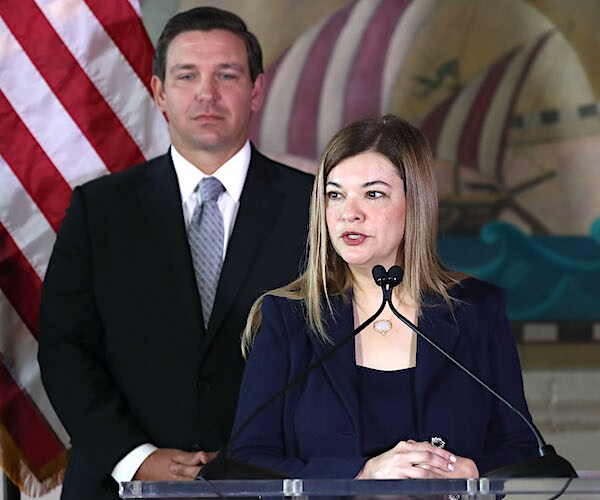 judge barbara lagoa speaks during his induction into the florida supreme court as florida gov. ron desantis looks on