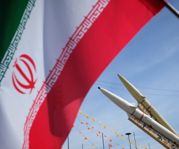 Missiles seen next to the Iranian flag