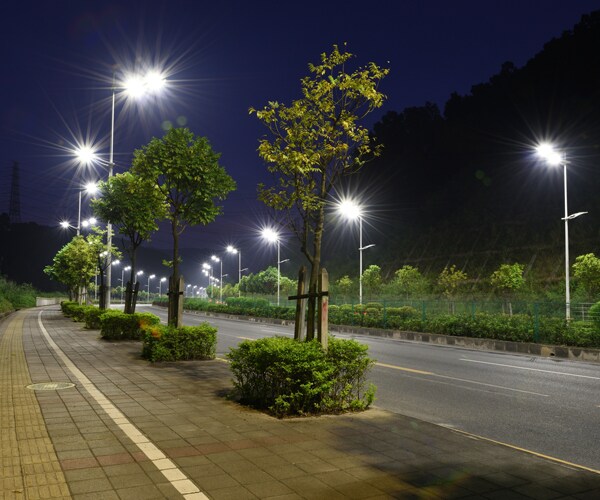 streetlamps powered by led lights line a street