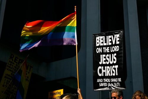 Religious Protesters Picket Near Gay Pride Flag