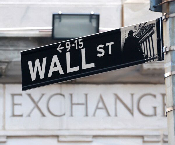 a sign for wall street in new york city