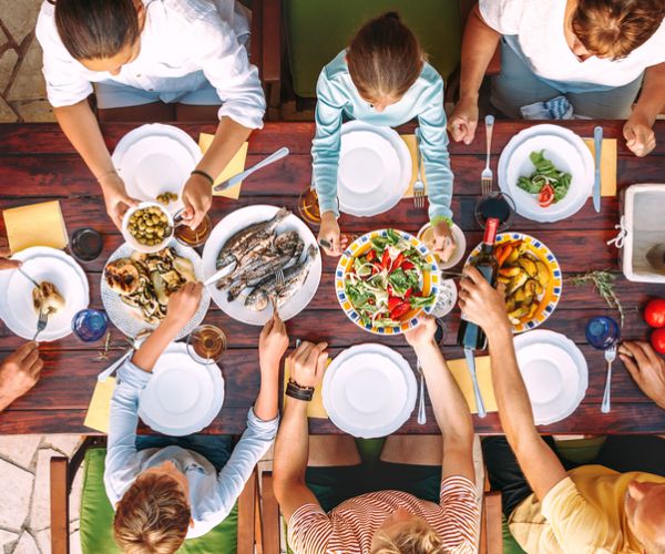 family eating dinner at the table together