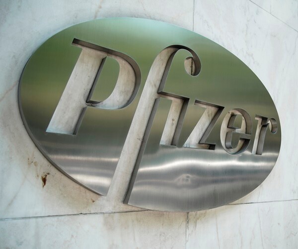 the pfizer logo in on the marble of a building