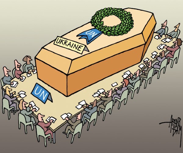 members of the united nations sitting around a meeting table with a giant coffin on the table labled ukraine