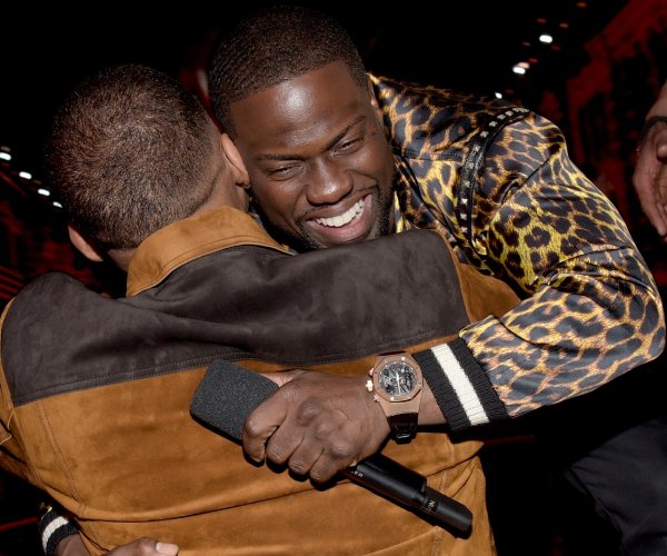 will smith, left, and kevin hart embrace at the 2016 mtv movie awards