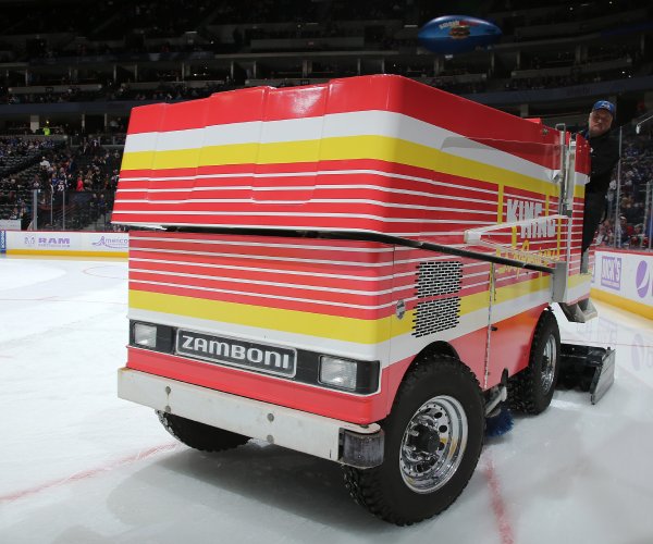 a zamboni prepares the ice at a nhl game