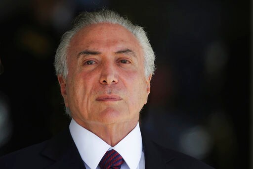 The Latest: Brazil's Electoral Court Keeps Temer in Office