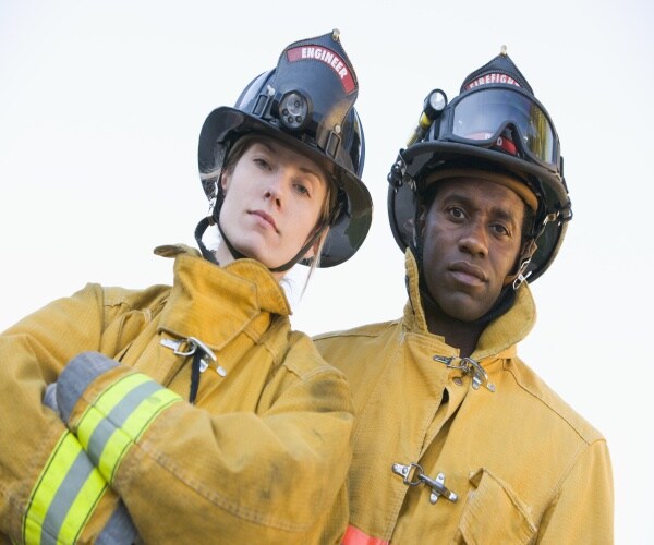 two firefighters looking at camera