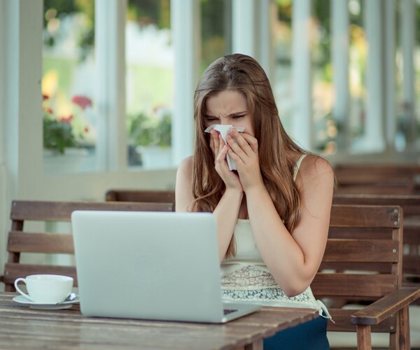 a woman sick while working