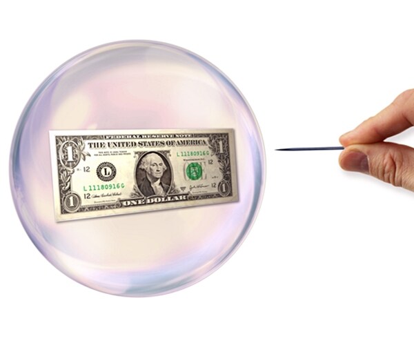 pin about to pop bubble encasing a us one dollar currency bill