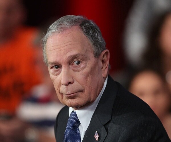 michael bloomberg sits onstage