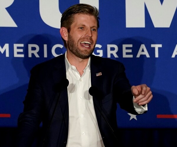 eric trump speaks onstage