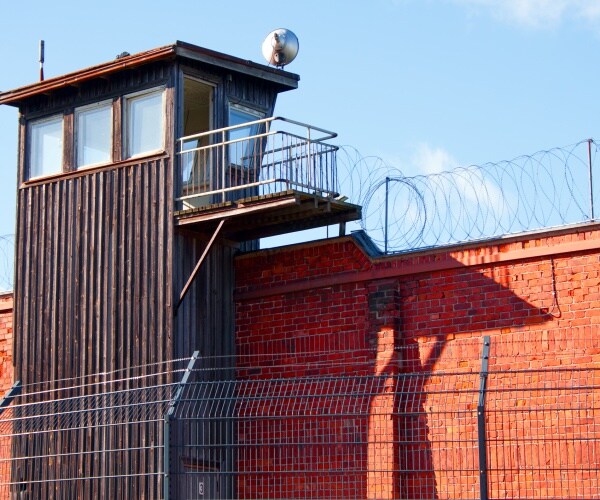 A guard tower on prison wall
