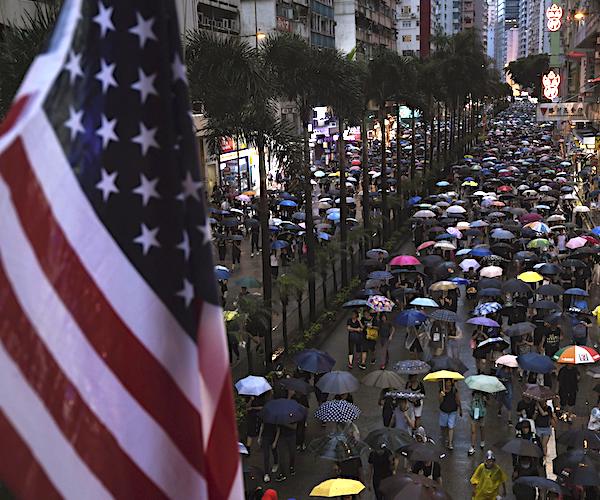 the American flag is pictured on a street in Hong Kong on Sunday, as a mass of people take part in a rally