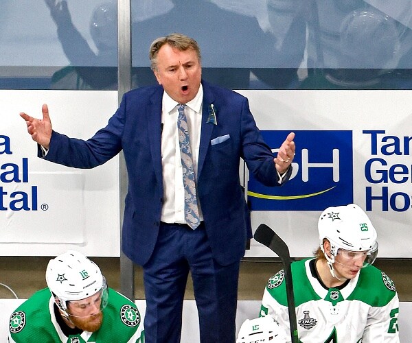 rick bowness stands behind bench