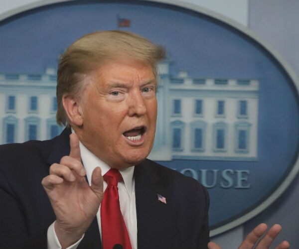 donald trump is shown during a white house task force briefing