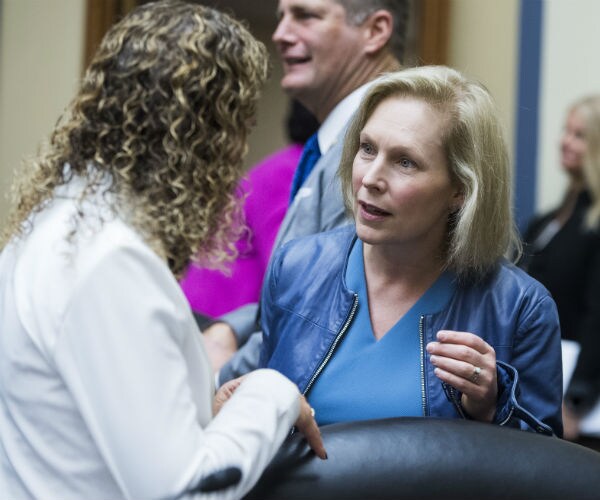 kirsten gillibrand and debbie wasserman schultz are seen before a house oversight and reform committee hearing