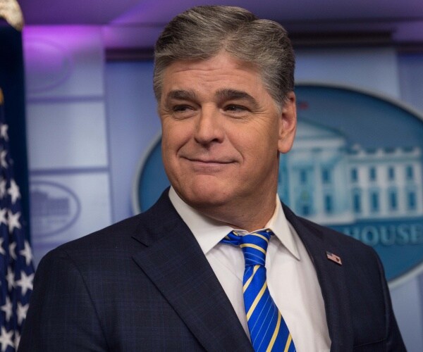 sean hannity in a blue striped tie and suit in the white house press briefing room