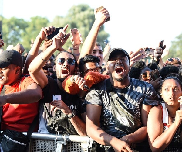 festival goers ad a musical concert.