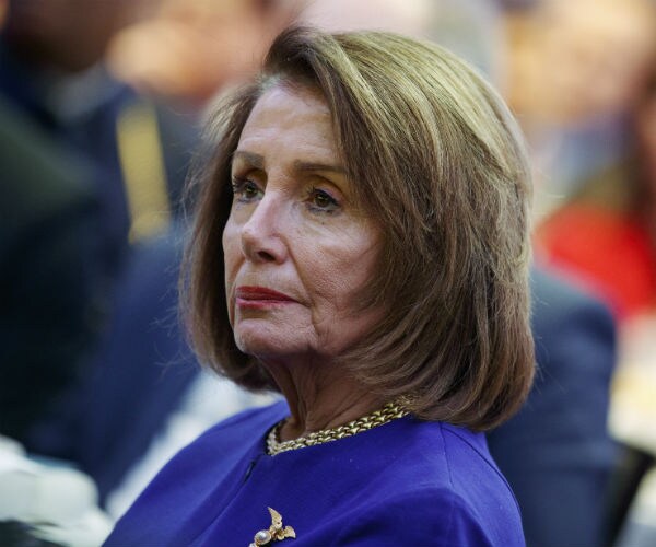 House Speaker Nancy Pelosi, D-Calif. is shown in a blue suit